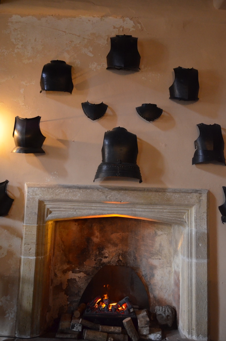 Several piece of armouries hang on the wall inside SIzergh castle
