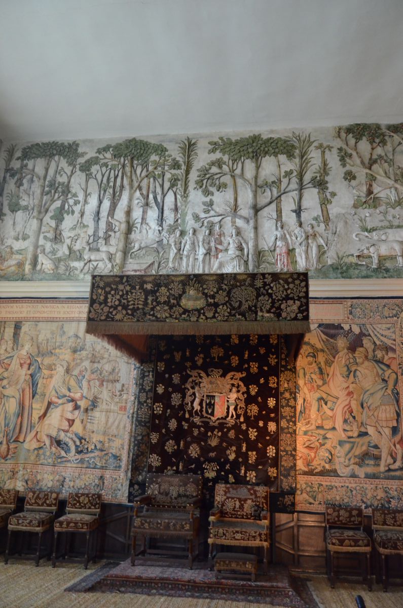 Tapestries and bed in a room in Hardwick Hall